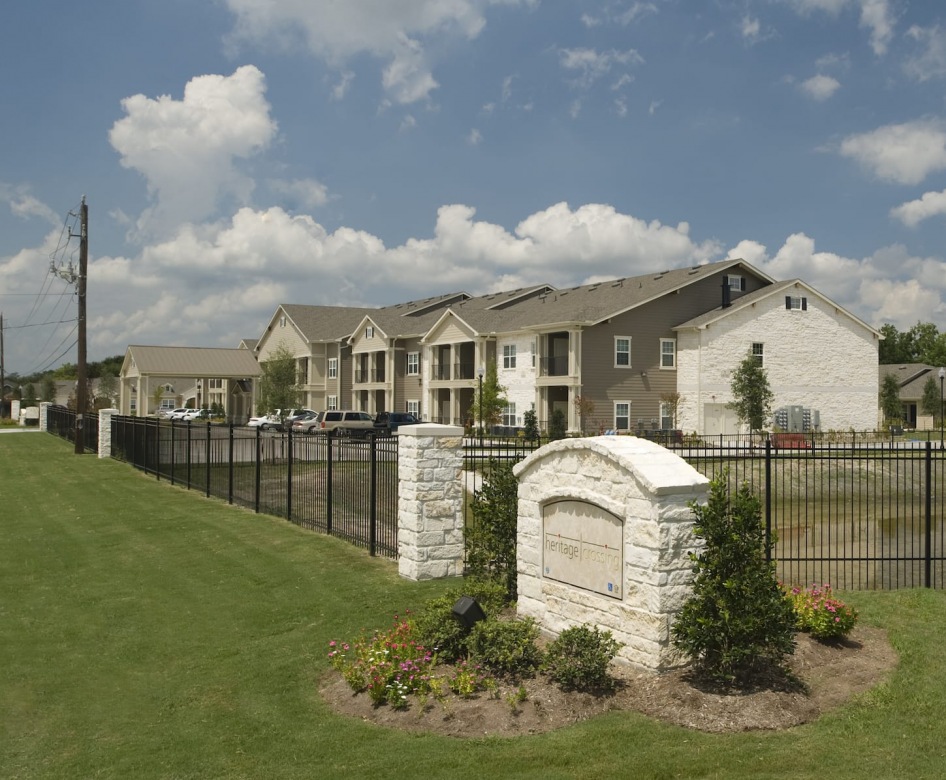 outside entrance to property showing some landscaping and spacious sidewalks