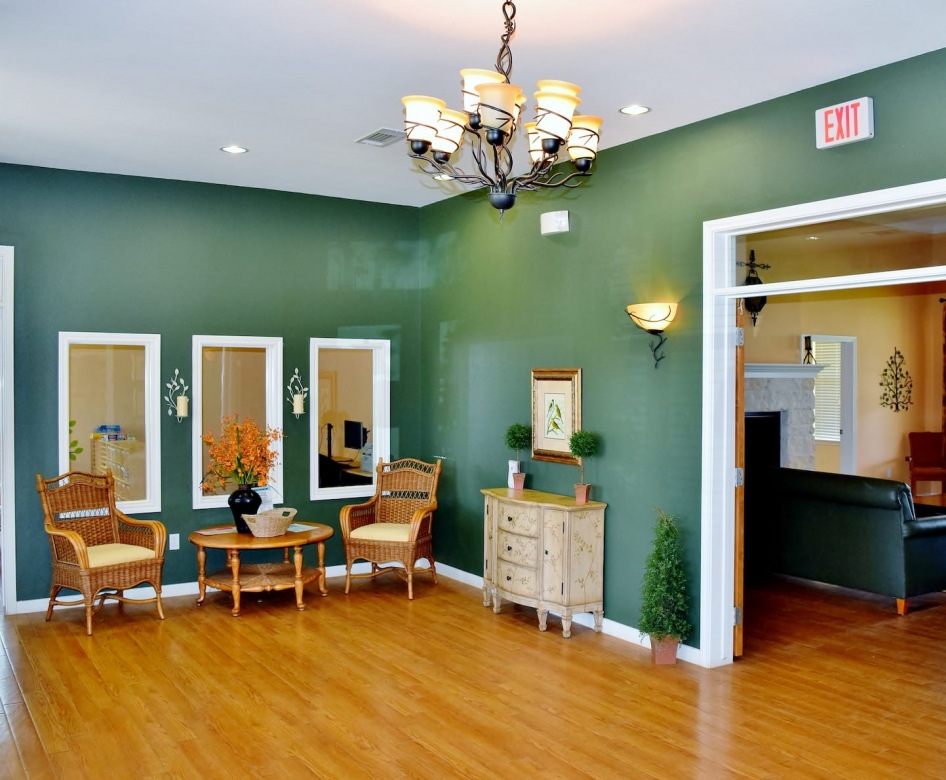 lobby area on wood-style flooring with green walls